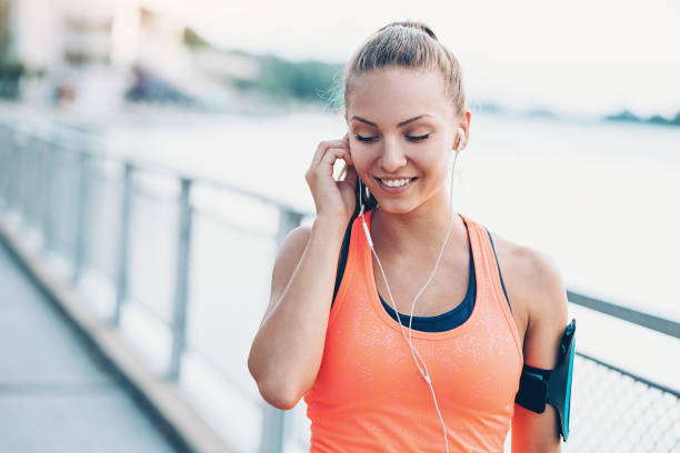 istock Young athlete with arm band and headphones 938100240