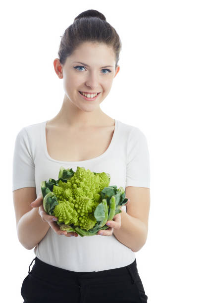 istock woman holding roman cabbage 938100314