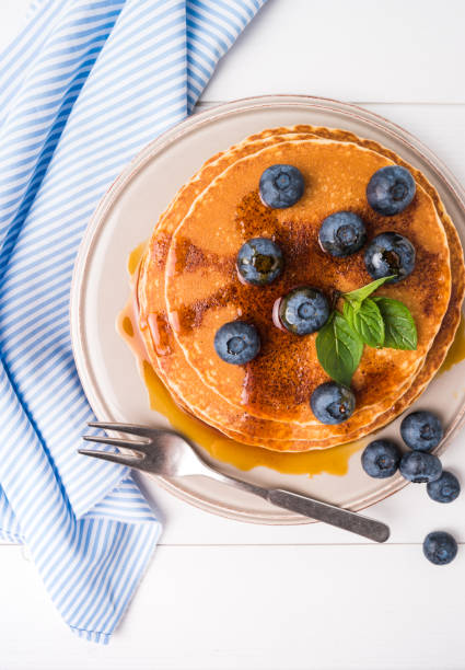 istock Stack of pancakes with fresh blueberry and caramel syrup 938105324