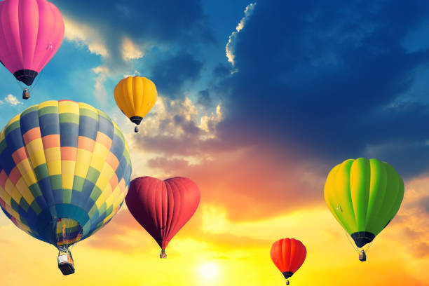 istock Colorful balloons floating in the sky at sunset. 938108300