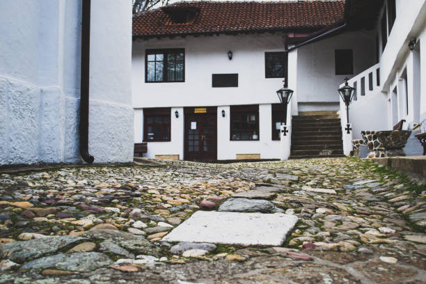 Old stone churchyard and white church