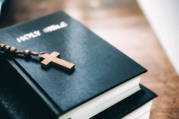 istock Holy Bilble with christian cross on table. 938108570