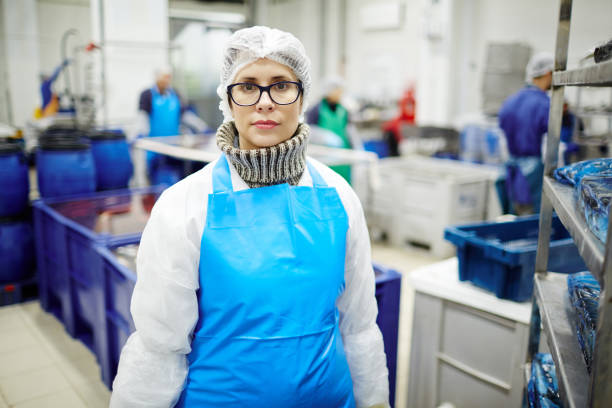 istock Woman in fish factory 938111108
