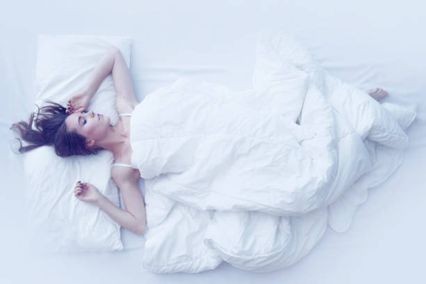 istock Young girl sleeping in bed 938112556