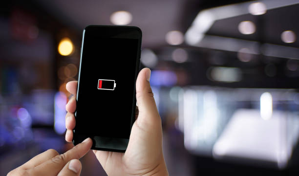 istock Close up man hands using smart phone battery low charged battery screen 938113864