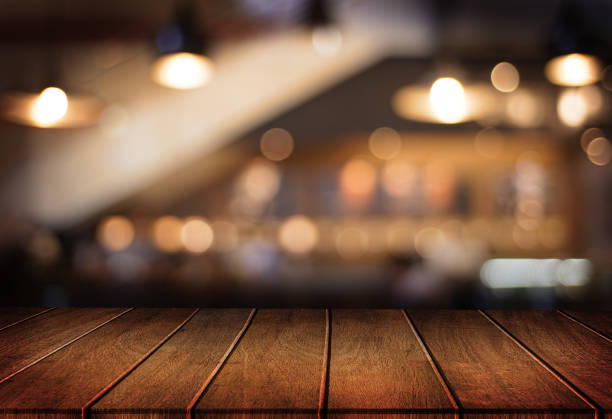 istock Wooden board empty table  cafe, coffee shop, bar blurred background can be used for display or montage your products and Mock up 938113882