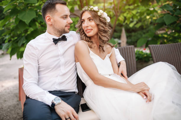 istock the bride and groom sit on a chair 938116110
