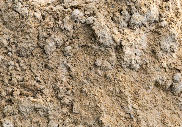 istock Gray sand mound pile beach part background texture 938116920
