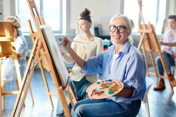 istock Woman by easel 938119266