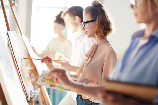 istock Concentrating on painting 938119348