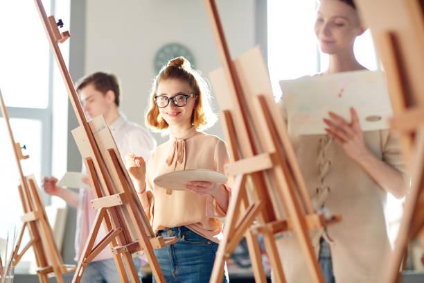 istock Girl at painting lesson 938119392