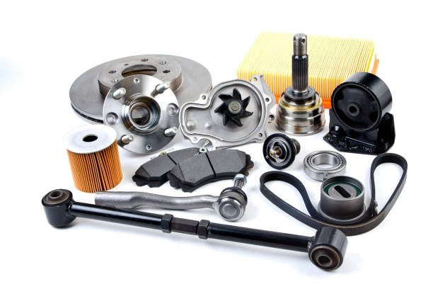 Auto parts background. Hub, pump, brake pads, filter, timing belt, rollers, constant velocity joints, thermostat and other on white background. Set of spare parts for repair Auto parts background. Hub, pump, brake pads, filter, timing belt, rollers, constant velocity joints, thermostat and other on white background. Set of spare parts for repair brake disc photos stock pictures, royalty-free photos & images