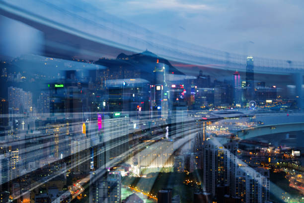 istock Moving train track motion over city office downtown night blurred light 938119602