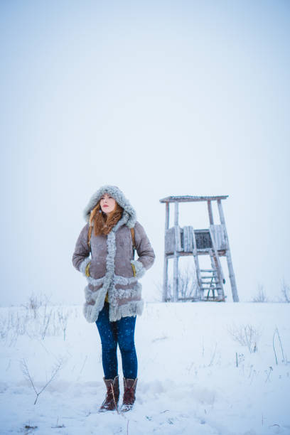 istock Pensive woman in winter nature 938119944