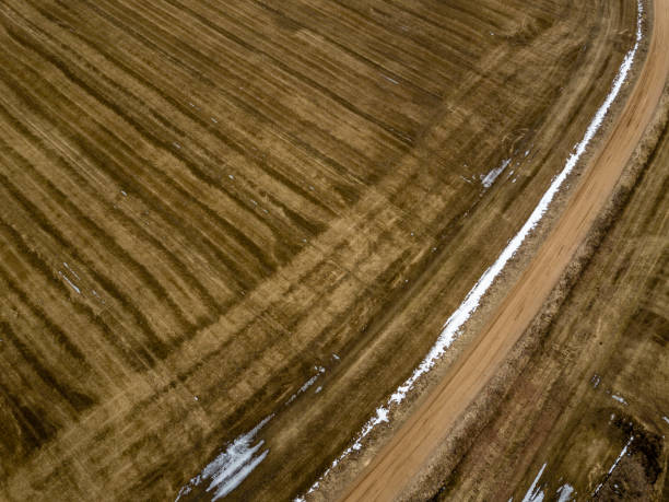 istock drone image. aerial view of rural area with fields in early spring 938122842