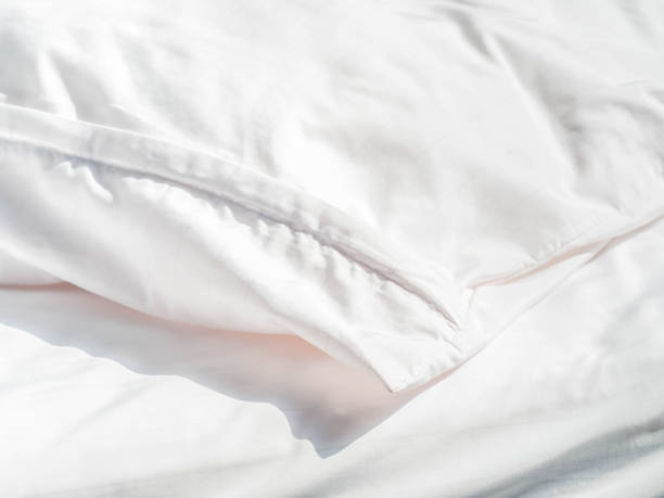 istock White wrinkles dust mite pillow and bedding cover. 938127266