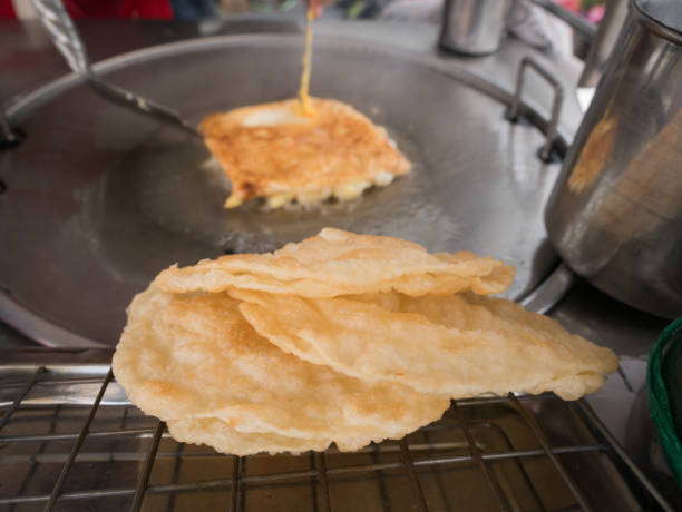 istock Roti Cook Flying Roti on The Cart 938128114