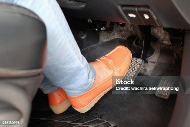 Closeup Foot Pressing Brake Pedal Of Car Stock Photo - Download Image Now - Gas  Pedal, Car, Brake - iStock
