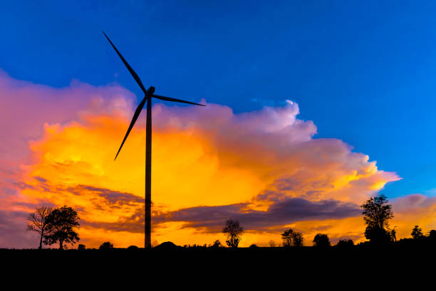 istock Wind turbine power generator on sunset. 938136712