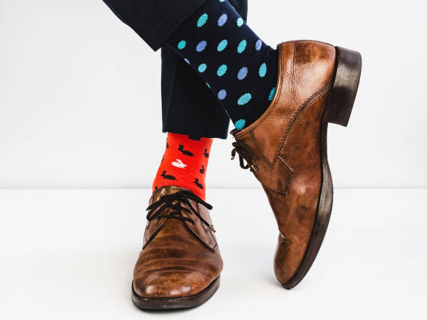 istock Stylish shoes and bright, funny, happy socks 938138130