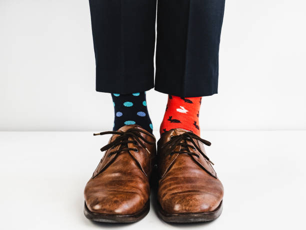 istock Stylish shoes and bright, funny, happy socks 938138192
