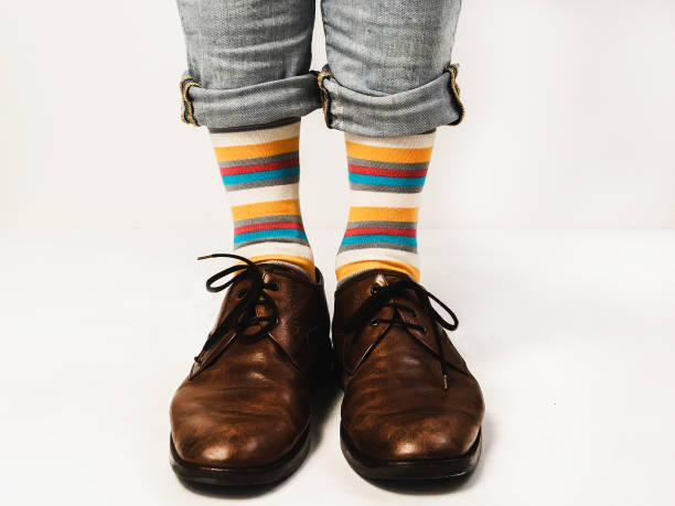 istock Stylish shoes and bright, funny, happy socks 938138608
