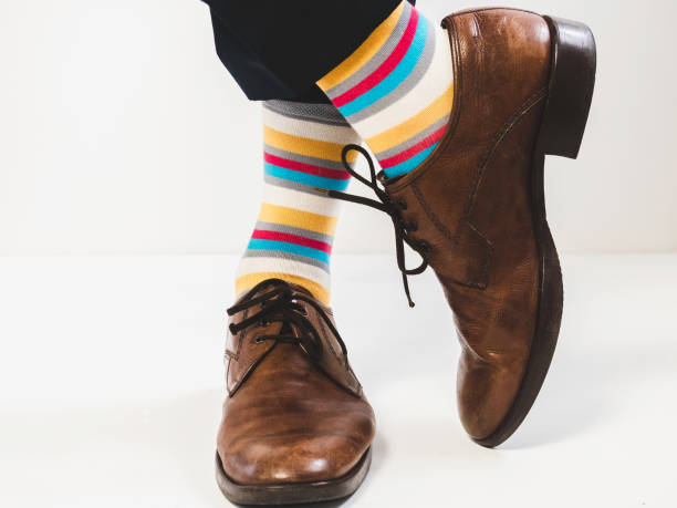 istock Stylish shoes and bright, funny, happy socks 938139458