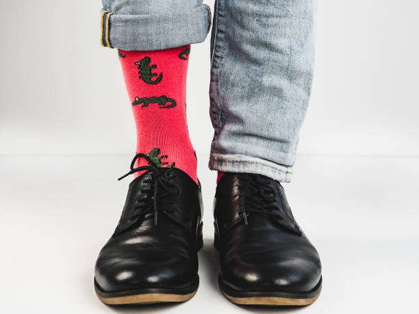 istock Stylish shoes and bright, funny, happy socks 938140858