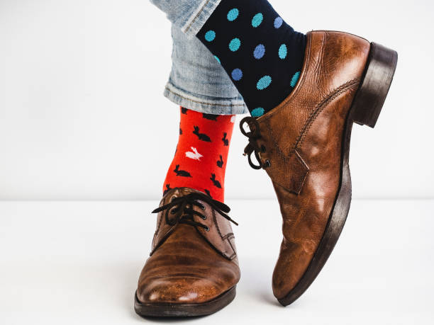 istock Stylish shoes and bright, funny, happy socks 938140946