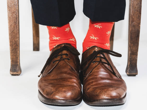 istock Stylish shoes and bright, funny, happy socks 938141142