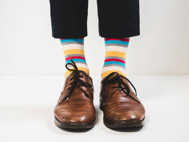 istock Stylish shoes and bright, funny, happy socks 938141234