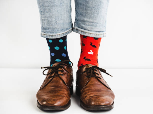 istock Stylish shoes and bright, funny, happy socks 938141330