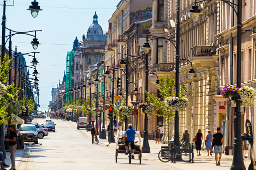 Lodz, Poland - August 09, 2017:Piotrkowska Street in Lodz, Poland. It is one of the longest commercial thoroughfares in Europe, with a length of 4.9 km. It is one of the major tourist attractions of the city.