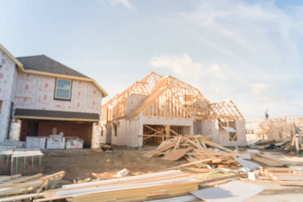 istock Blurred abstract wood frame house under construction in Irving, Texas, USA 938145020