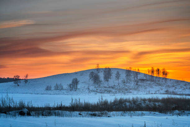 Noctilucent clouds at sunset. South Ural, Russia