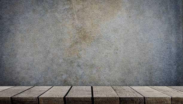 istock Blank wooden display shelf on gray cement wall 938146350
