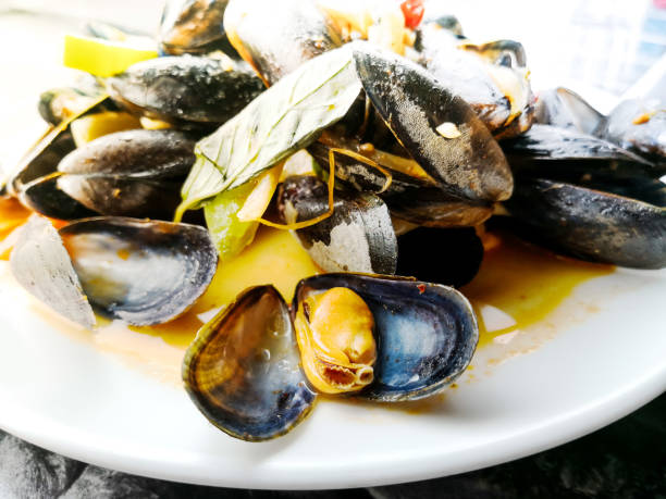 istock Mussel with white wine sauce on table 938149134