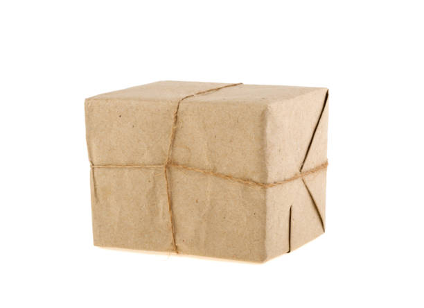 istock postal packet packed in gray paper bundled rope isolated on white background 938149862