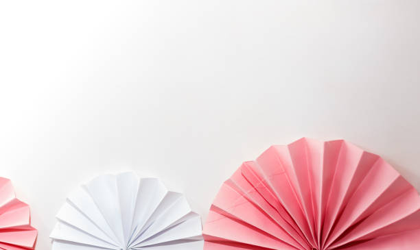 Pink and white striped paper fans