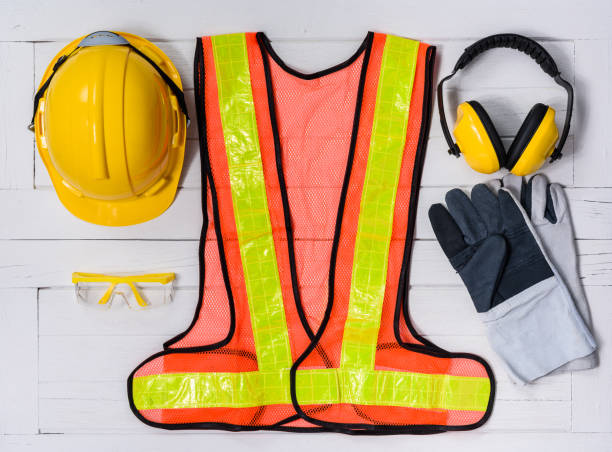 istock Standard construction safety equipment on wooden table. top view 938159702