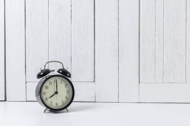istock Vintage background with retro alarm clock on table 938162984