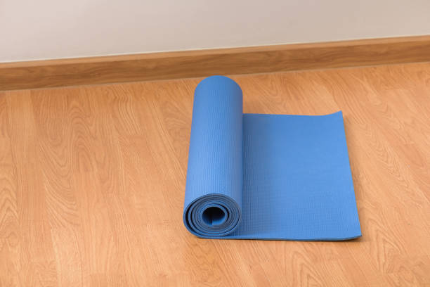 istock Yoga Mat on wooden floor 938163074
