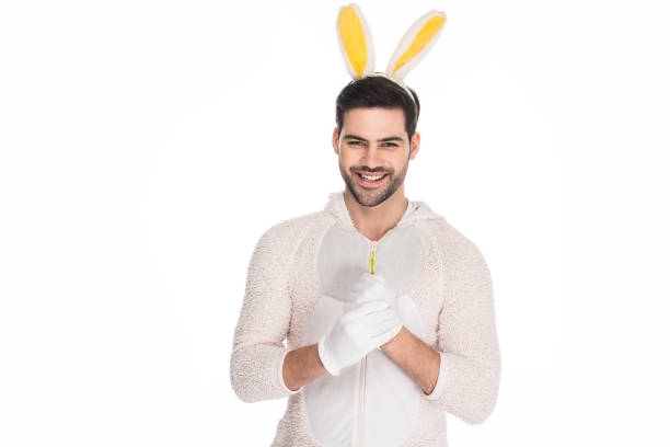 istock Smiling young man in costume of rabbit isolated on white, easter concept 938165600
