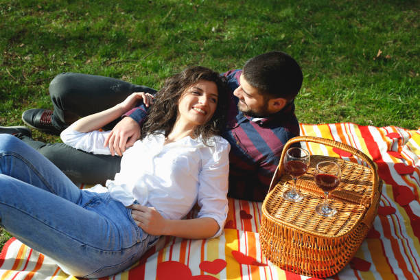 istock Happy couple in love at a picnic 938167020