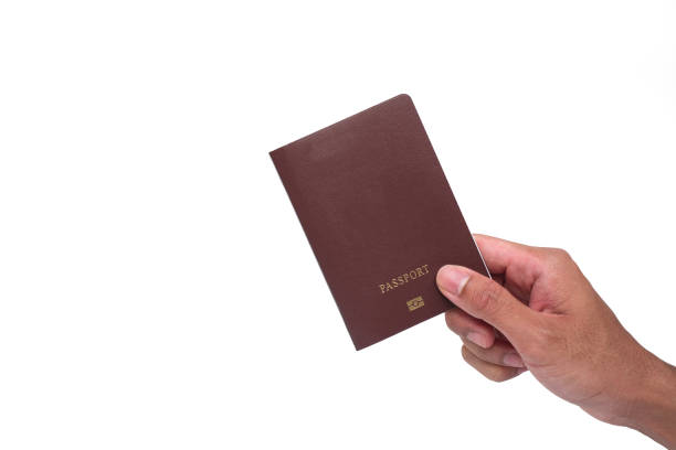 istock Hand holding passport from Thailand on white background 938174398