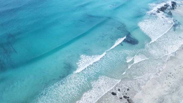 istock Wave on the beach as a background. Beautiful natural background at the summer time 938175648