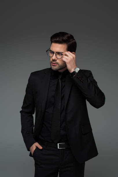 istock Young stylish man in glasses standing isolated on grey 938178064