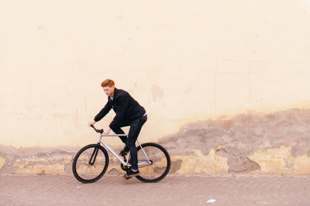 istock Young handsome hipster man riding fix bike 938181448