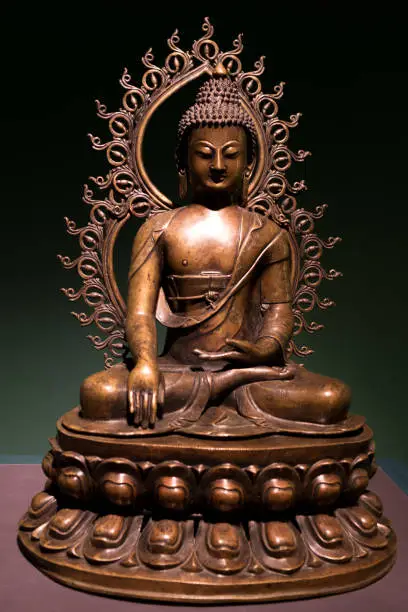 Buddha seen as in the position of taking the land as a renunciation of the earthly pleasures and desires offered by the demon Mara (the illusion) in exchange for his non-enlightenment.