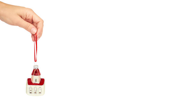 istock Cristmas decoration, ceramic house in hand isolated on white background. New Year object. copy space, template 938185880